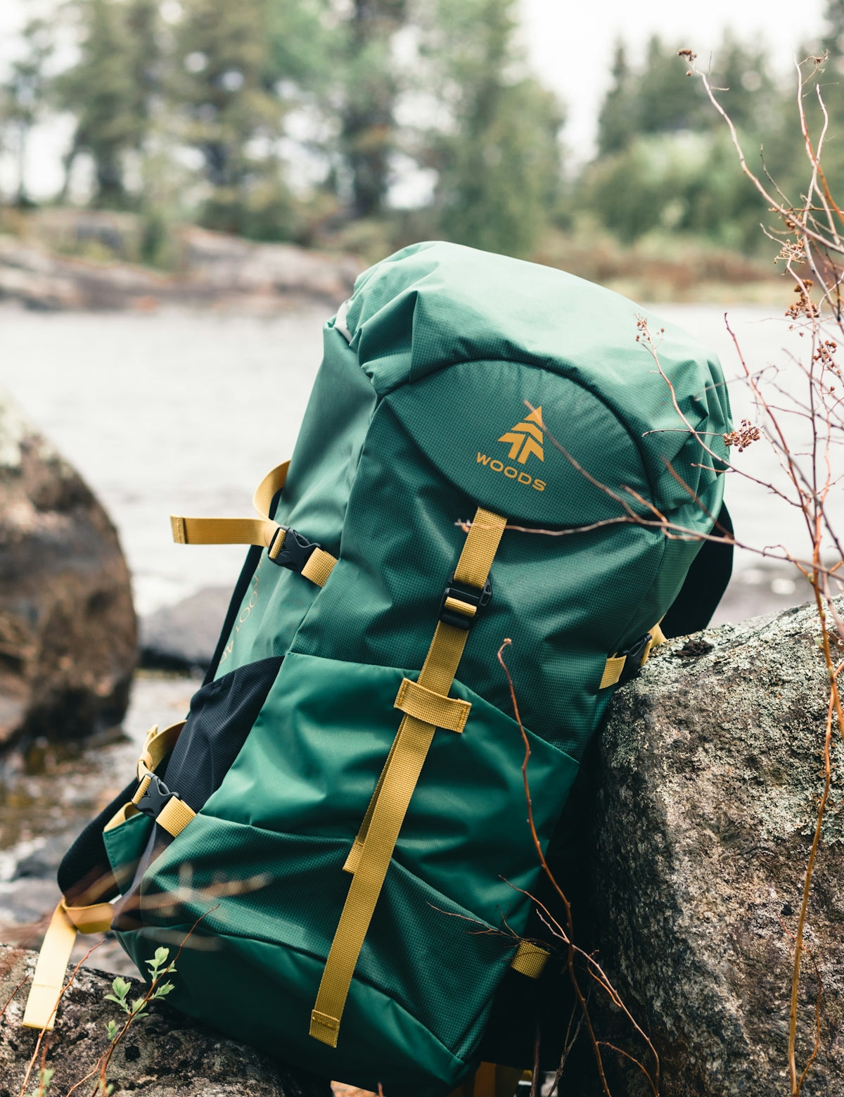green and brown backpack on rock