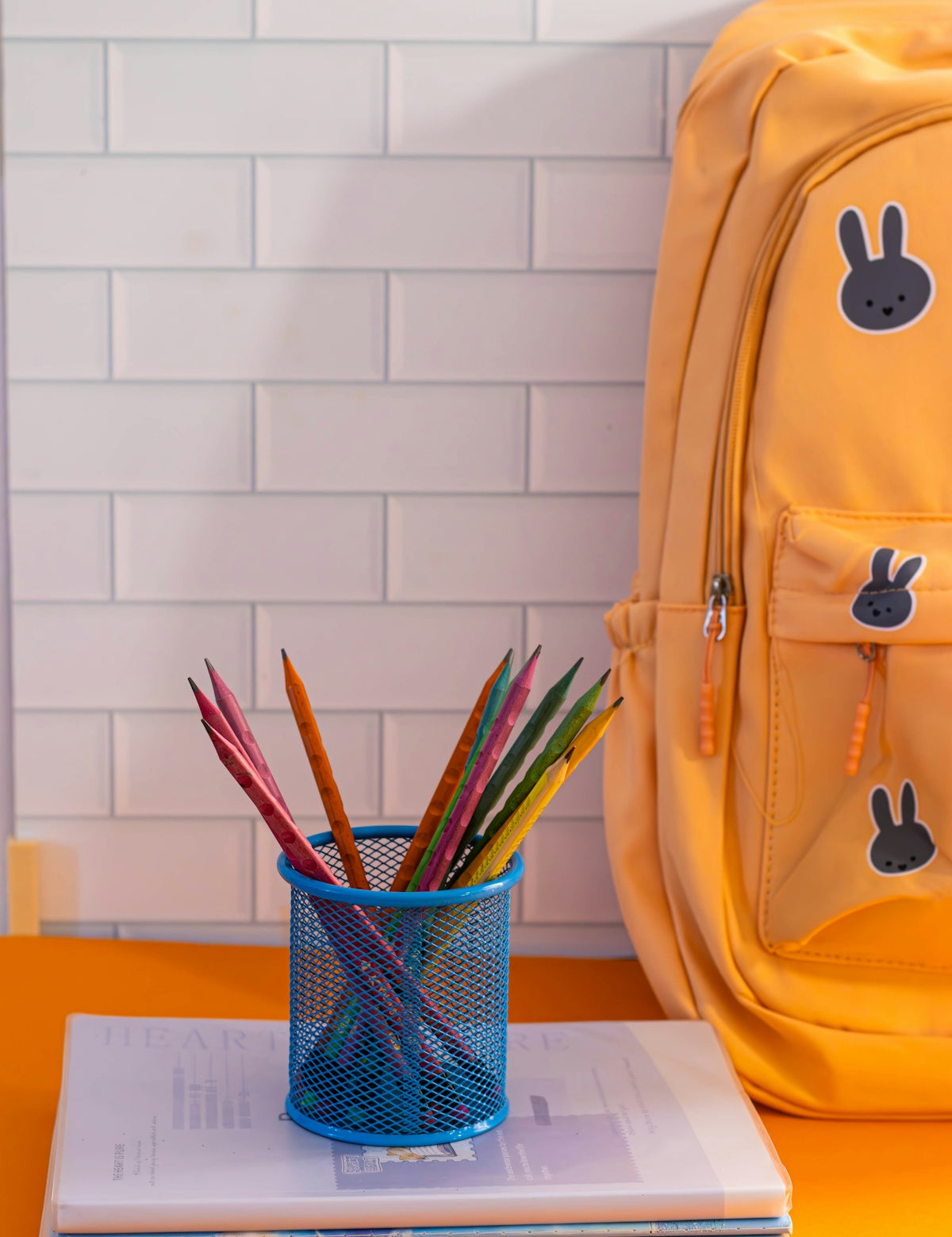 A yellow backpack sitting on top of a table