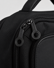 Close-up of VENQUE branded zipper pulls on the Envoy Business Pack