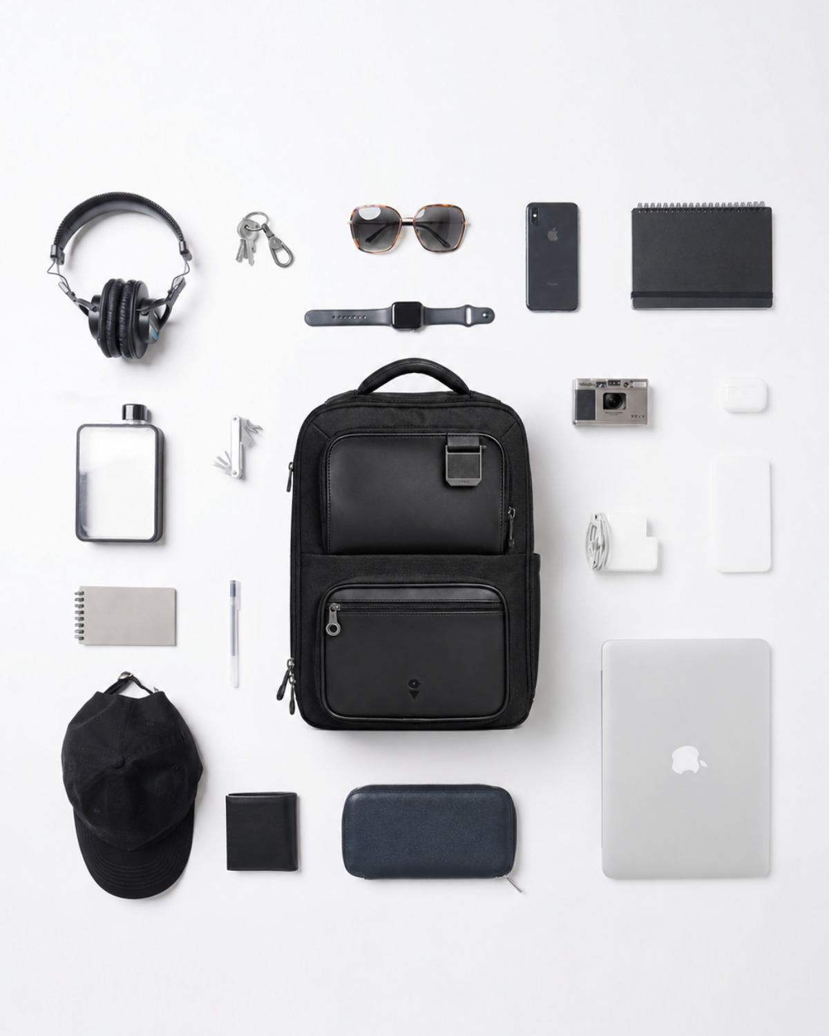 Envoy Business Pack flat lay with everyday carry essentials