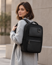Woman wearing the Envoy Business Pack against a neutral wall