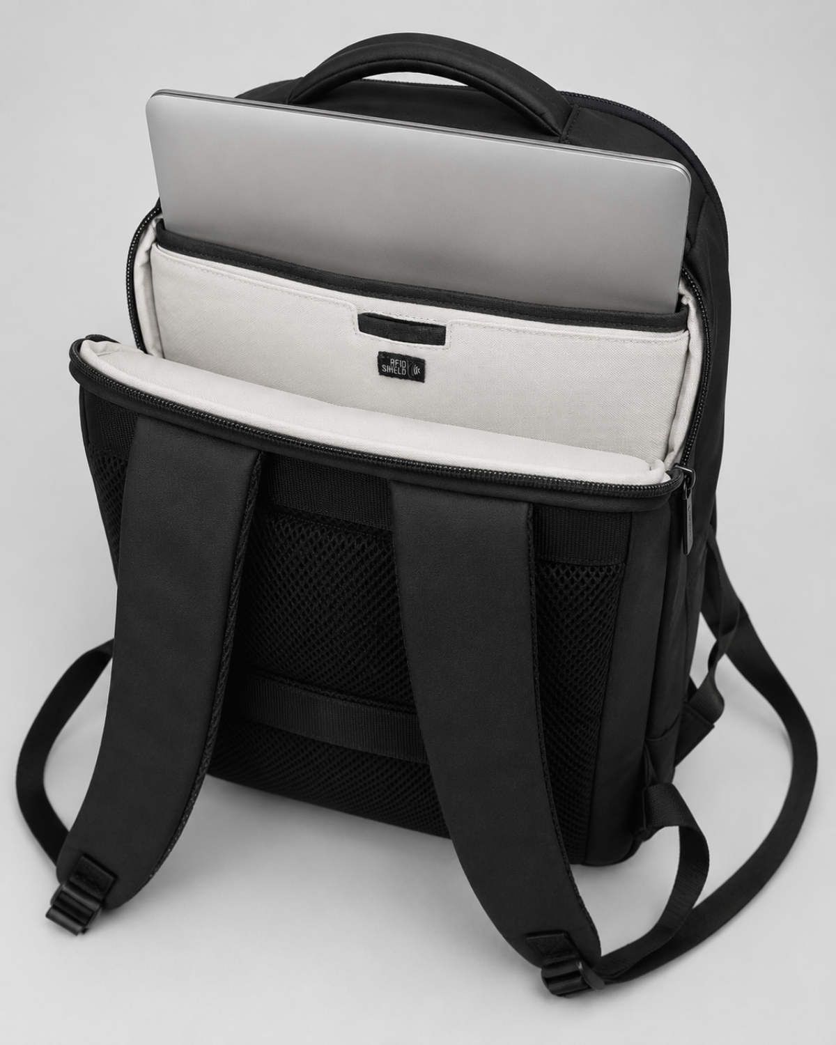 Rear laptop compartment of the Envoy Business Pack with a laptop inside