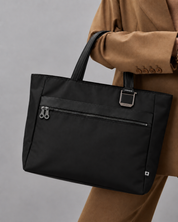 Voya Executive Tote carried with a camel coat for business