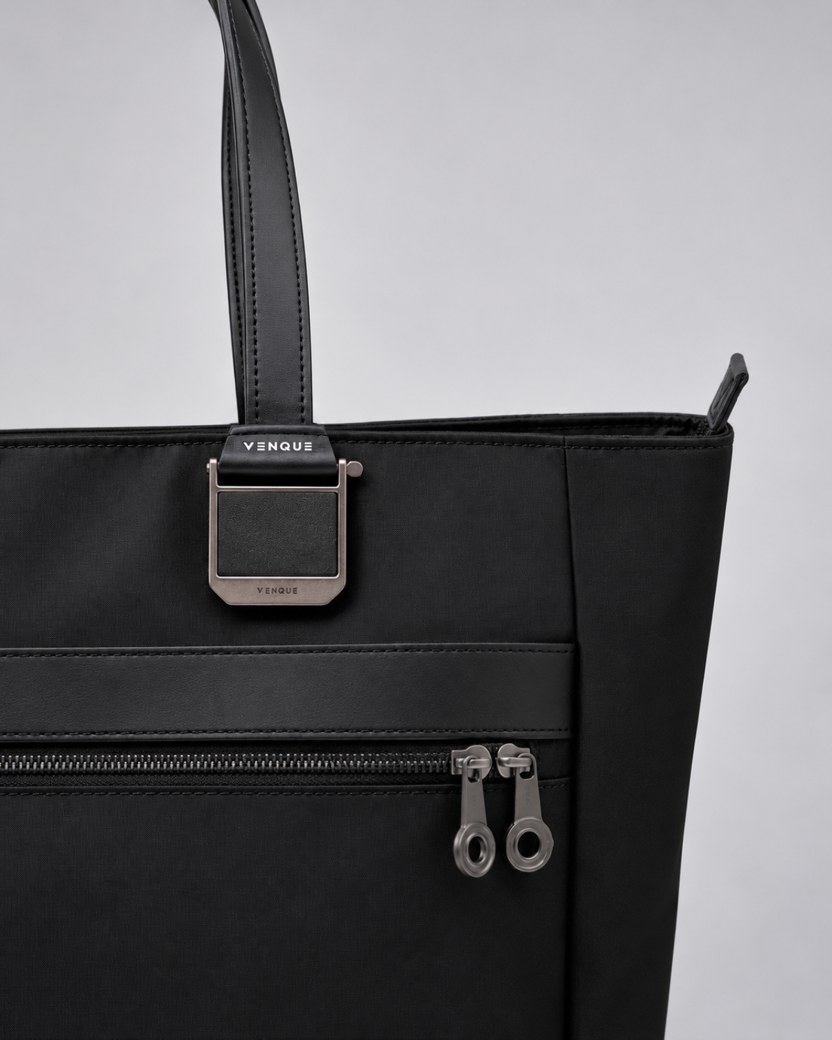 Close-up of the VENQUE metal hardware on the Voya Executive Tote