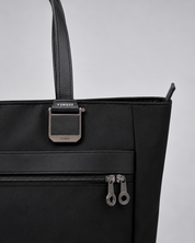 Close-up of the VENQUE metal hardware on the Voya Executive Tote